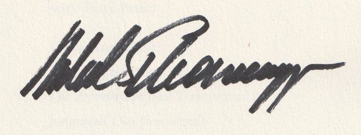 Close-up of Arnold Schwarzenegger’s autograph on signed book - AMAA Authenticated